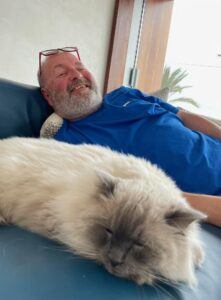 Find cat sitter Dave, with a furry Ragdoll cat sleeping — Trusted and reliable cat sitter